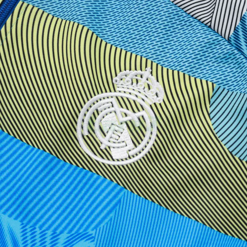 Chandal Real Madrid 2025/2026 en Azul y Verde a Rayas