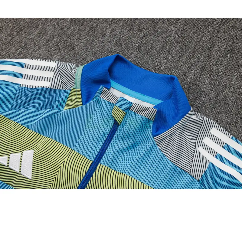 Chandal Real Madrid 2025/2026 en Azul y Verde a Rayas